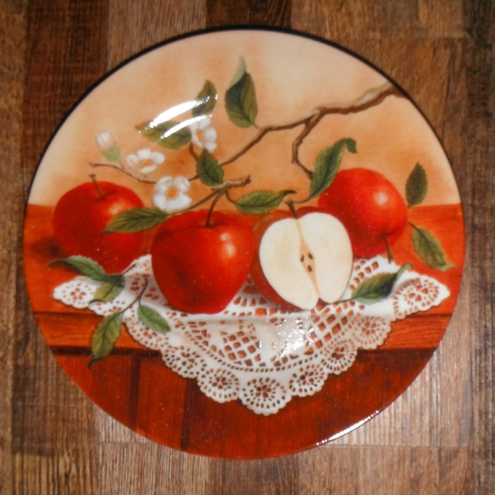 three 8" ceramic plates, aple designs, multicolor
